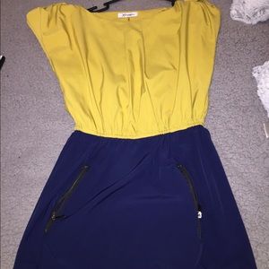 It’s a mustard yellow and dark blue dress